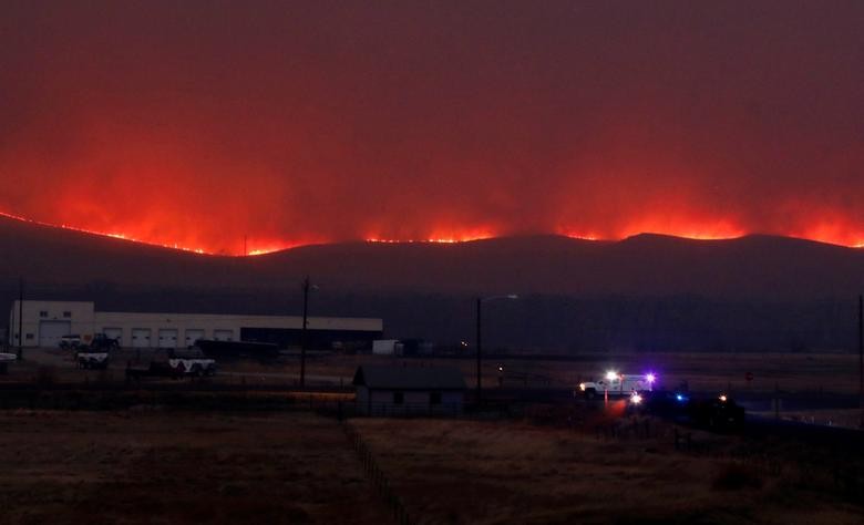 Flames illuminate the sky as the East Troublesome Fire burns outside Granby, Colorado. REUTERS/Jim Urquhart    